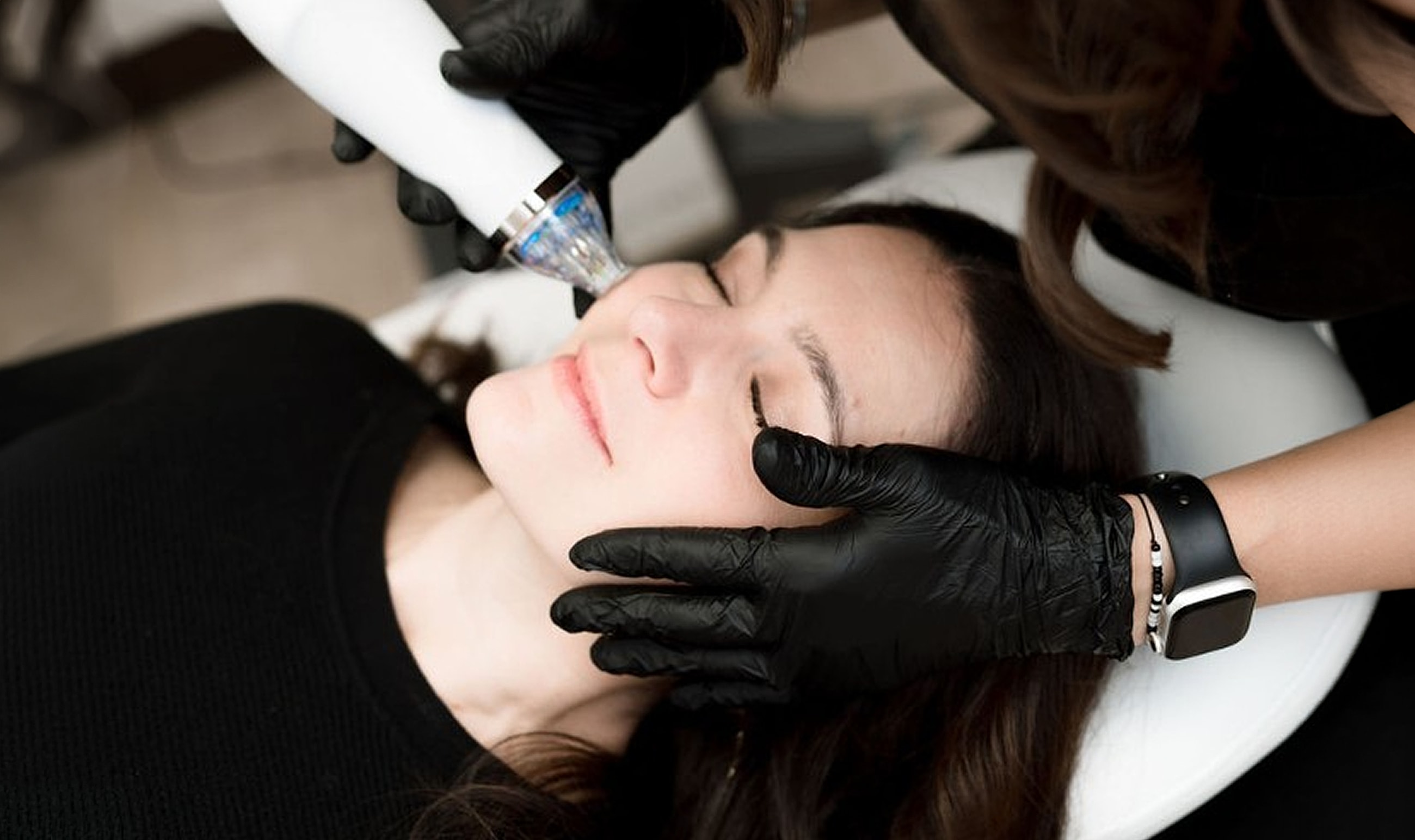 Facial treatment procedure in a skincare clinic.